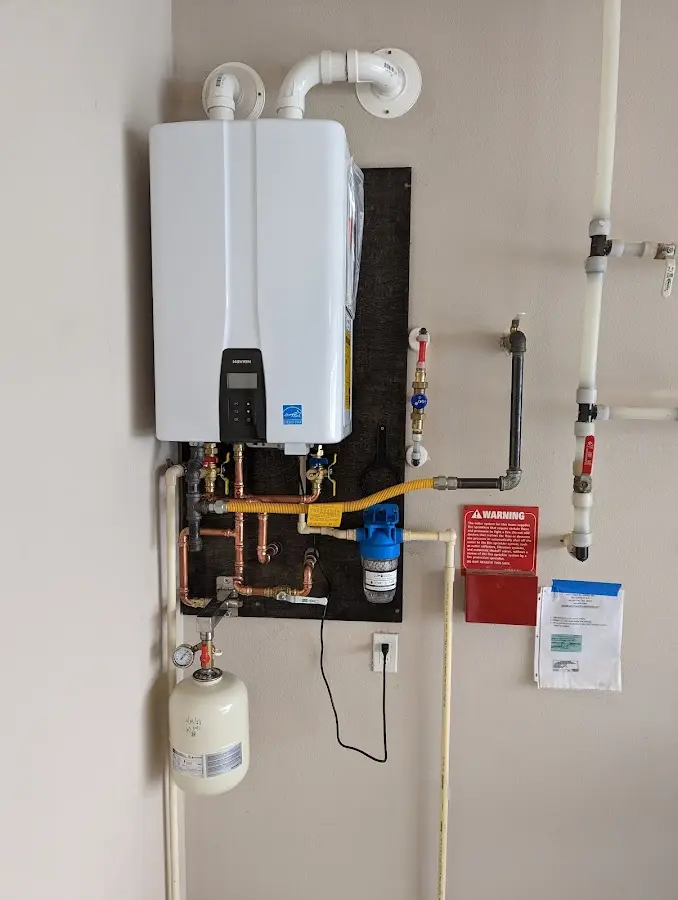 Professional plumber installing copper piping in a Cherry Grove home